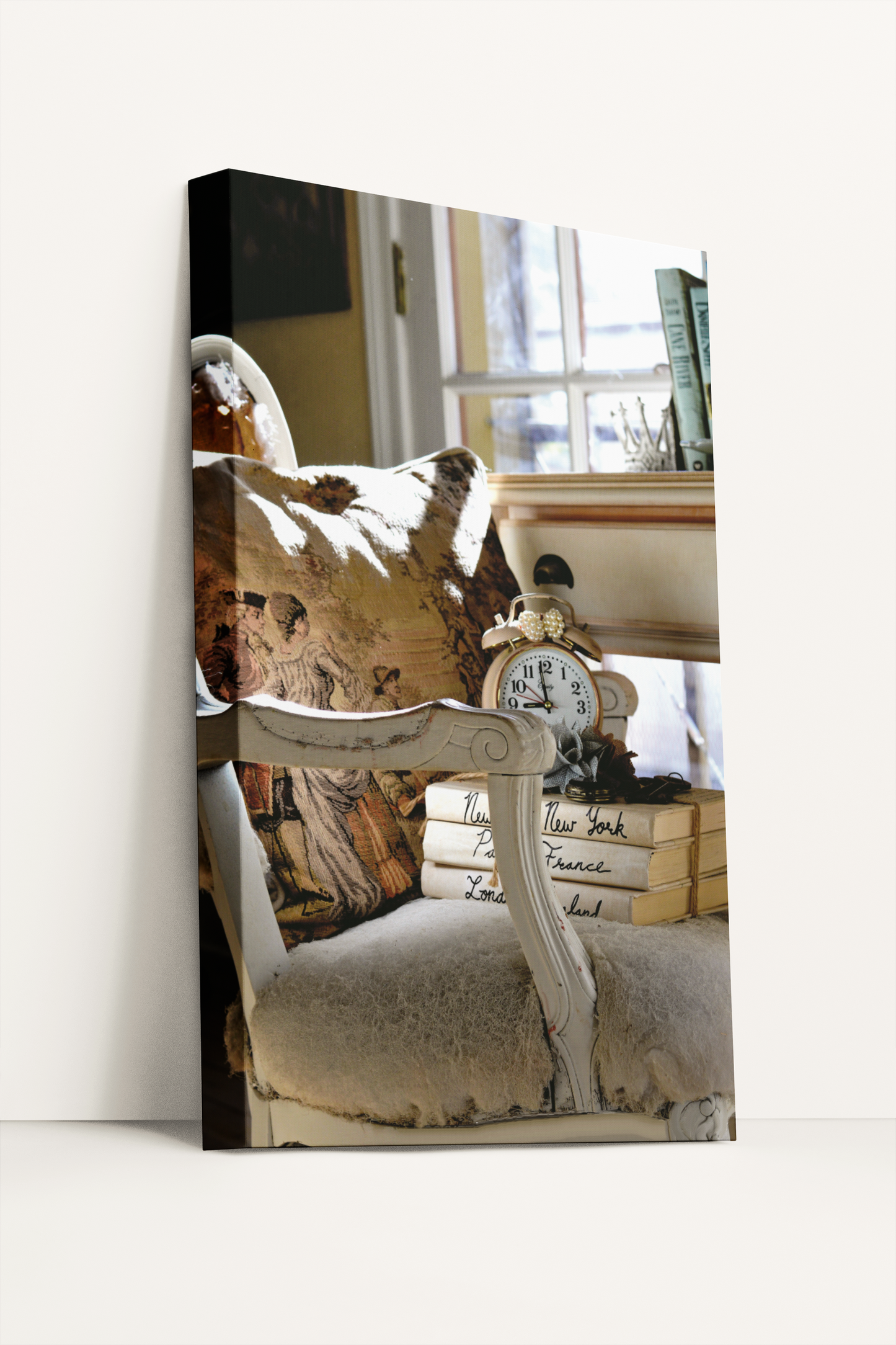 Antique chair, books, and clock in cottage home photography canvas print